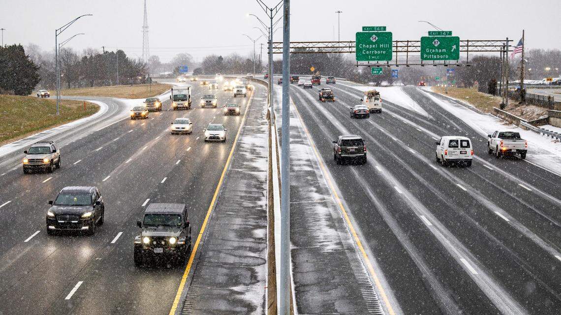 A view of afternoon rush hour traffic on Interstate 40 in Graham as snow flurries fall Friday, Dec. 10, 2025.