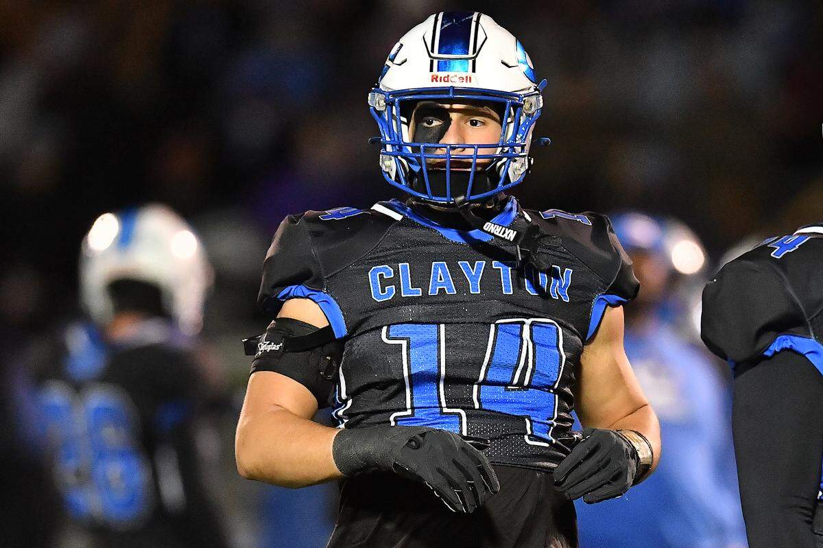 Clayton tight end River Fiore (14) looks to the sideline during the pre-game drills before taking on Southeast Raleigh in the 7A fourth round of playoffs. The Clayton Comets and the Southeast Raleigh Bulldogs met in the fourth round of the NCHSAA 7A Playoffs in Clayton, N.C. on November 28, 2025.
