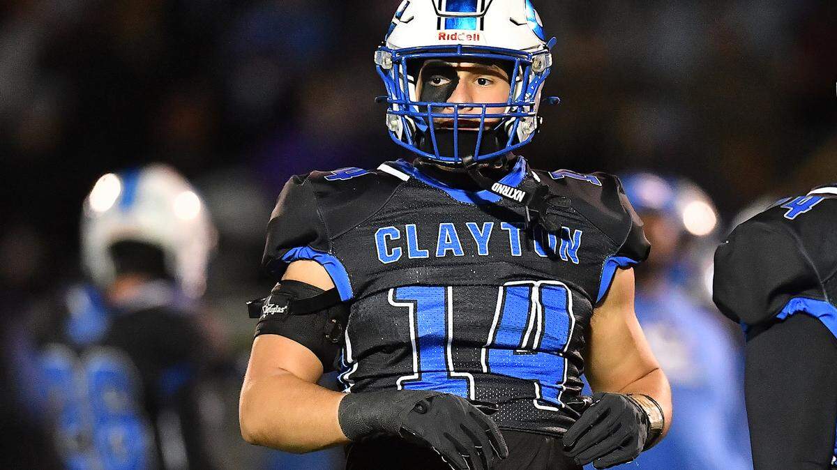 Clayton tight end River Fiore (14) looks to the sideline during the pre-game drills before taking on Southeast Raleigh in the 7A fourth round of playoffs. The Clayton Comets and the Southeast Raleigh Bulldogs met in the fourth round of the NCHSAA 7A Playoffs in Clayton, N.C. on November 28, 2025.