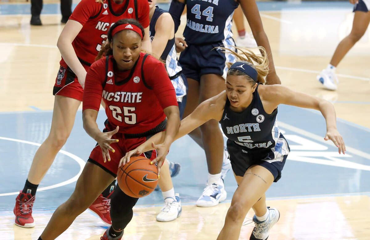 North Carolina’s Stephanie Watts (5) knocks the ball from N.C. State’s Kayla Jones (25) during the first half of N.C. State’s game against UNC at Carmichael Arena in Chapel Hill, N.C., Sunday, February 7, 2021.
