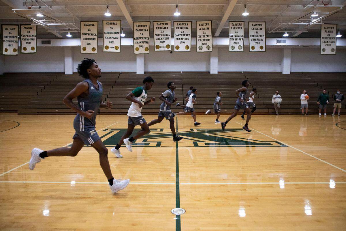 Kinston High School basketball teams practice under the many championship banners decorating their gym, pictured here on Jan. 10, 2022.