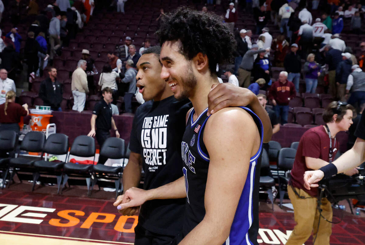 Duke’s Jaylen Blakes, left, and Jared McCain laugh as they walk off the court after Duke’s 77-67 victory over Virginia Tech at Cassell Coliseum in Blacksburg, Va., Monday, Jan. 29, 2024.