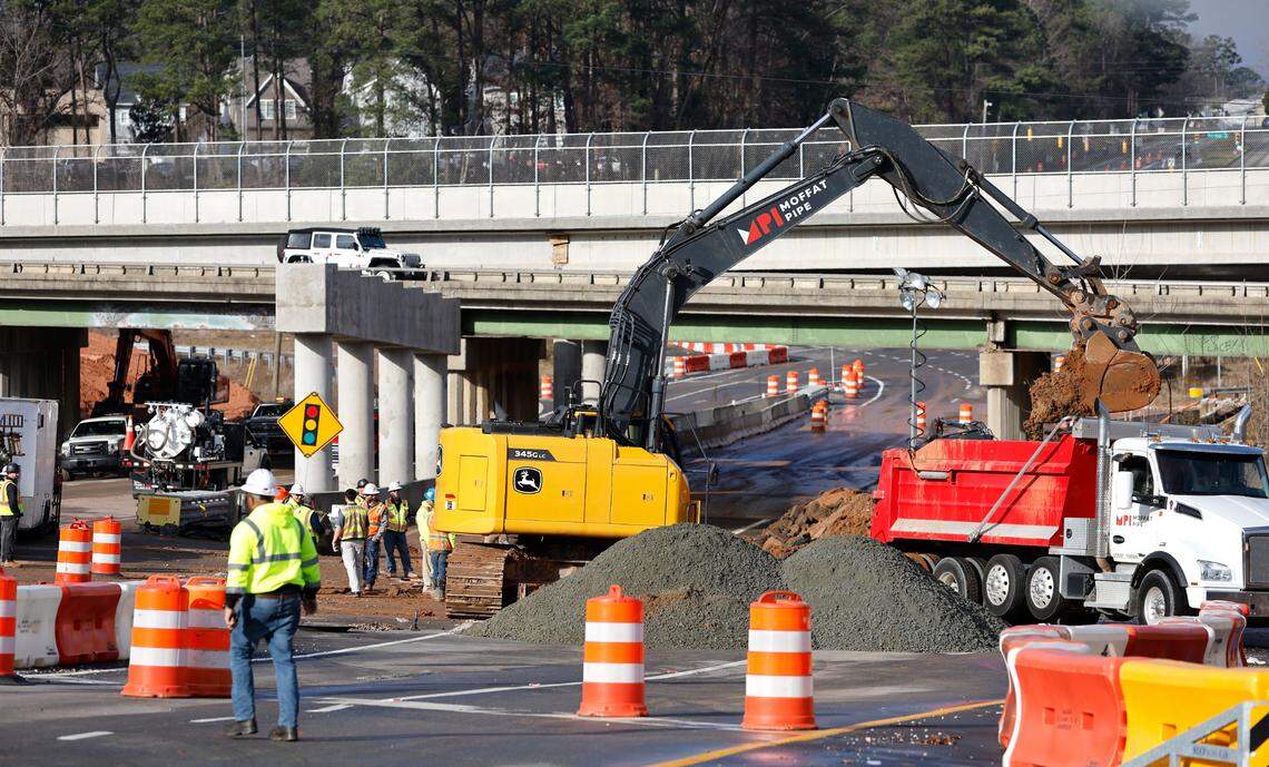 Work continues to fix a water main break at Western Boulevard at the Interstate 440 Beltline on Thursday morning, Jan. 5, 2023. The break, which occurred on Wednesday, shut down Western.