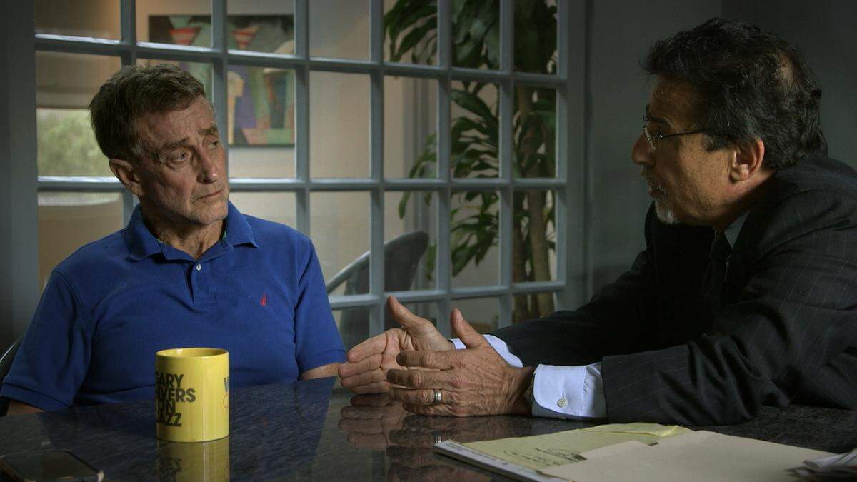 The real-life Michael Peterson, left, discusses case strategy with Charlotte attorney David Rudolf in a scene from “The Staircase” documentary series on Netflix.