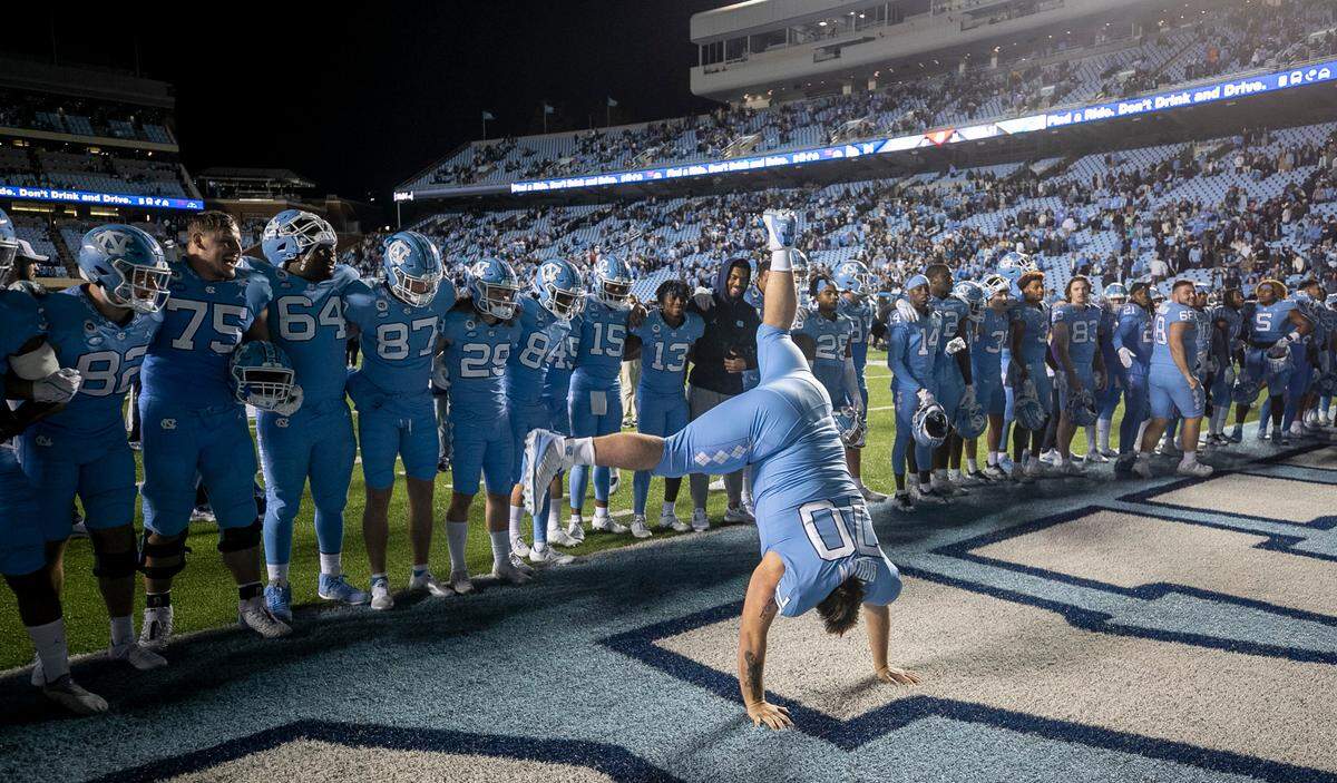 North Carolina’s Noland Brown (70) does a cartwheel as he celebrates the the Tar Heels’ 42-24 victory over Pitt on Saturday, October 29, 2022 at Kenan Stadium in Chapel Hill, N.C.