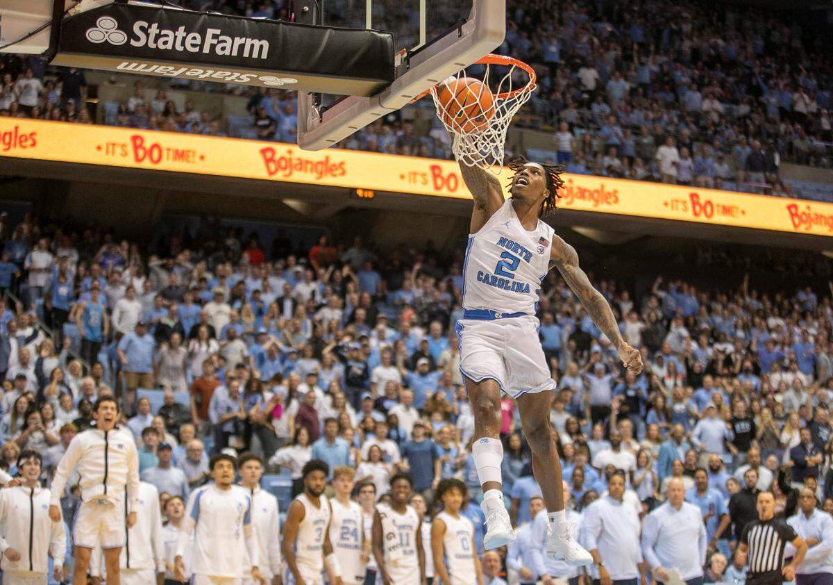 North Carolina’s Caleb Love (2) goes to the basket for a dunk to give the Tar Heels a 102-84 lead against College of Charleston in the final seconds of play on Friday, November 11, 2022 at the Smith Center in Chapel Hill, N.C.