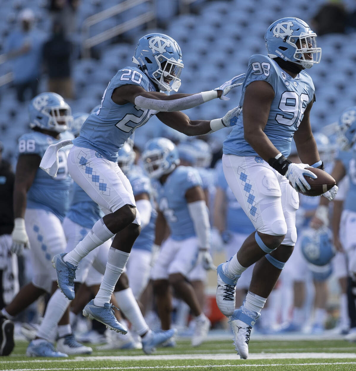 North Carolina’s Kevin Hester Jr. (98) celebrates after recovering a fumble by Western Carolina in the second quarter on Saturday, December 5, 2020 at Kenan Stadium in Chapel Hill, N.C.