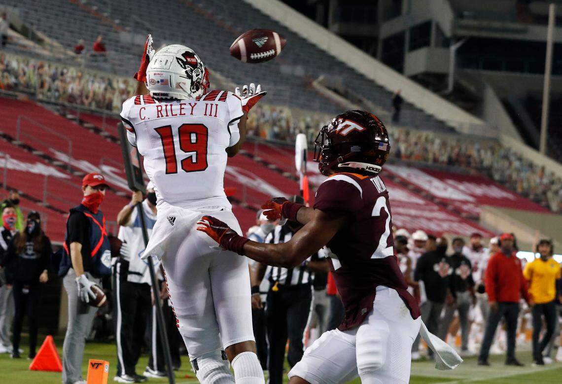 N.C. State wide receiver C.J. Riley (19) pulls in a seven-yard touchdown reception as Virginia Tech’s Devin Taylor defends during the second half of Virginia Tech’s 45-24 victory over N.C. State at Lane Stadium in Blacksburg, VA Saturday, Sept. 26, 2020.