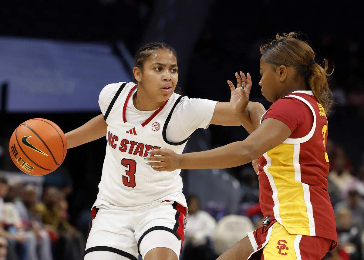 N.C. State’s Zamareya Jones handles the ball under pressure from Southern California’s Londynn Jones during the first half of the Wolfpack’s game on Sunday, Nov. 9, 2025, at Spectrum Center in Charlotte, North Carolina.