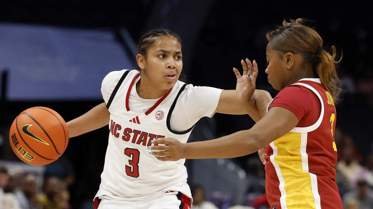N.C. State’s Zamareya Jones handles the ball under pressure from Southern California’s Londynn Jones during the first half of the Wolfpack’s game on Sunday, Nov. 9, 2025, at Spectrum Center in Charlotte, N.C.