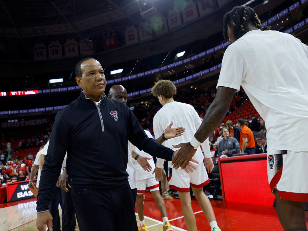 North Carolina State head coach Kevin Keatts congratulates his team following the Wolfpack’s 73-67 win over Campbell at PNC Arena in Raleigh, N.C. on Friday, Nov. 11, 2022.