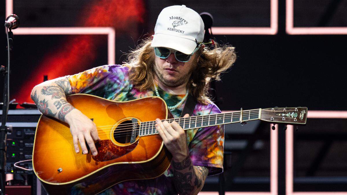 Billy Strings picks with his band on the first of their three-night run at Cary, N.C.’s Booth Amphitheater, Thursday, July 13, 2023.