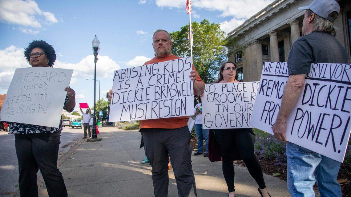 Some demonstrators call for the resignation of Johnston County Commissioner Richard “Dickie” Braswell prior to a Johnston County Board of Commissioners meeting at the Johnson County Courthouse in Smithfield on Monday, May, 1, 2023. Braswell, 74, was arrested last June after a 13-year-old girl told officers at the Johnston County Sheriff’s Office that she had an “inappropriate interaction with an adult male acquaintance.”