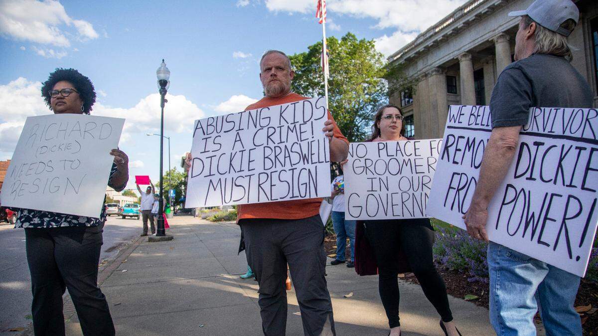 Some demonstrators call for the resignation of Johnston County Commissioner Richard “Dickie” Braswell prior to a Johnston County Board of Commissioners meeting at the Johnson County Courthouse in Smithfield on Monday, May, 1, 2023. Braswell, 74, was arrested last June after a 13-year-old girl told officers at the Johnston County Sheriff’s Office that she had an “inappropriate interaction with an adult male acquaintance.”
