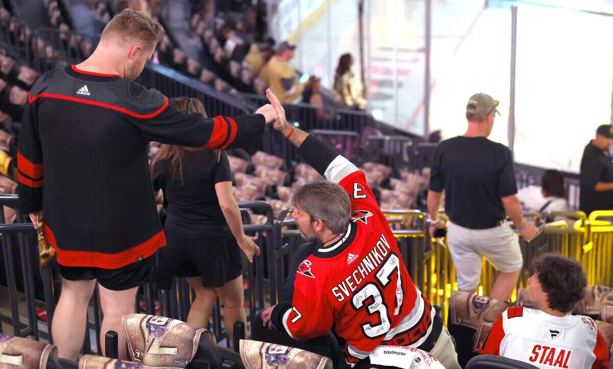Canes fans greet each other before the Hurricanes’ game against the Golden Knights in Game 6 of the Stanley Cup Final at T-Mobile Arena in Las Vegas, Nev., Sunday, June 14, 2026.