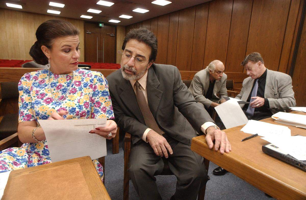 Durham assistant District Attorney Freda Black looks over paperwork with defense attorney David Rudolf Friday morning as the Michael Peterson murder trial finished it’s sixth week of jury selection.