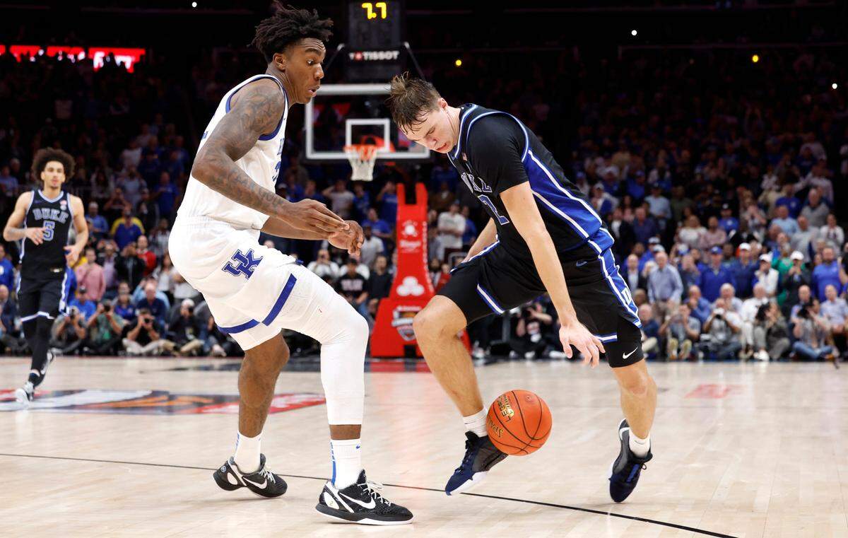 Duke’s Cooper Flagg (2) loses control of the ball off his foot with seven seconds left in the game during Kentucky’s 77-72 victory over Duke in the State Farm Champions Classic in Atlanta, Ga., Tuesday, Nov. 12, 2024. Flagg would try to regain control but lost it out of bounds.