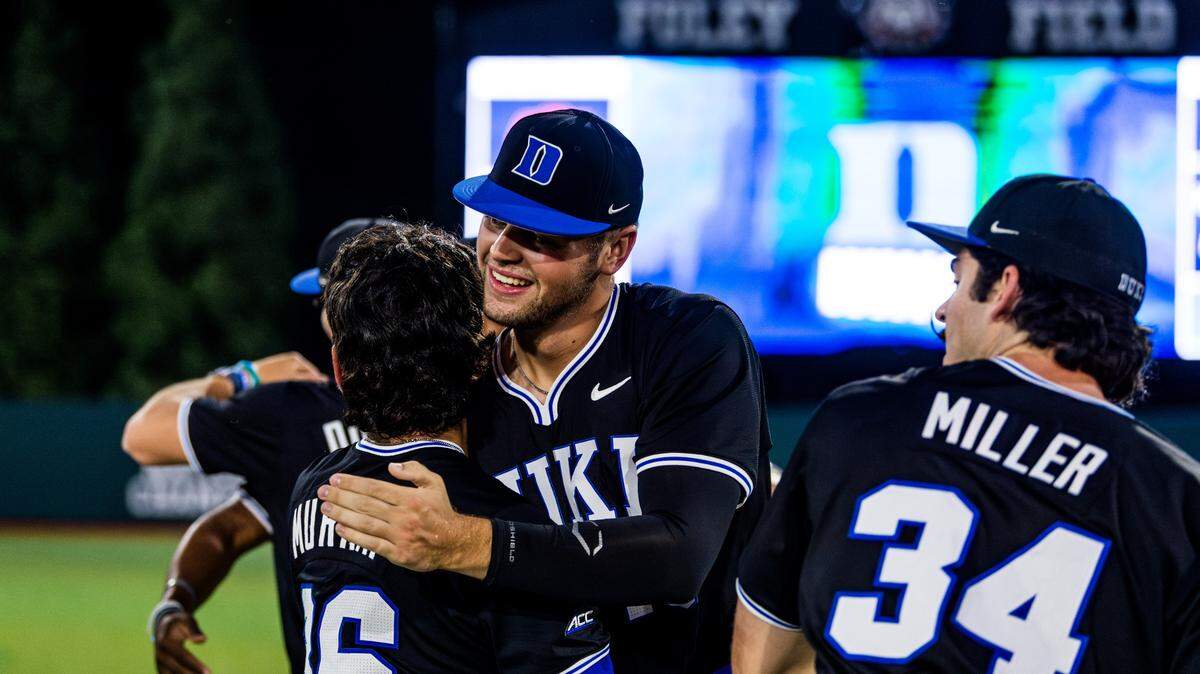 Duke’s Sam Harris (center) celebrates with teammates Noah Murray (36) and Ben Miller (34) after the Blue Devils beat Oklahoma State, 3-2, to win the NCAA tournament Athens Regional on Sunday, June 1, 2025, at Foley Field in Athens, Georgia.