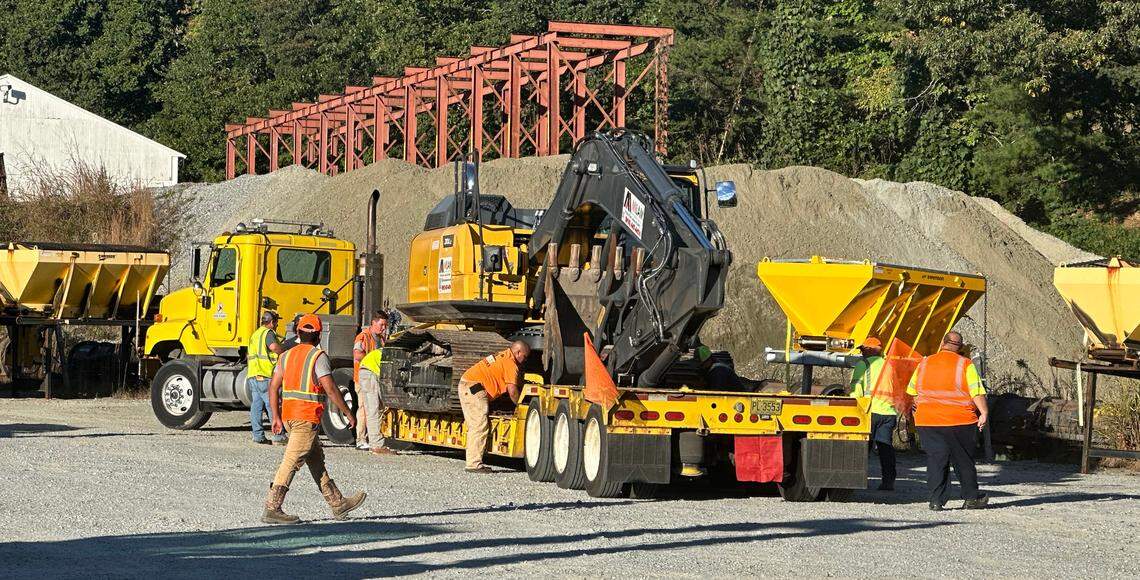 Men and equipment from N.C. Department of Transportation’s Division 3, based near Wilmington, arrive at the NCDOT maintenance yard near Hendersonville on Wednesday, Oct. 9, 2024. The convoy came to relieve another group from Division 3 that had spent the previous week clearing and repairing roads after Hurricane Helene.