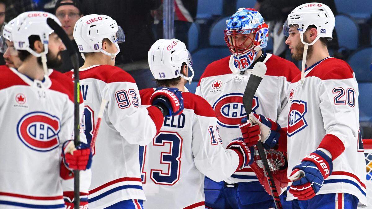The Montréal Canadiens celebrate after defeating the Buffalo Sabres, 6-3, in Game 5 of the second round of the 2026 Stanley Cup Playoffs at KeyBank Center on May 14, 2026 in Buffalo, New York.