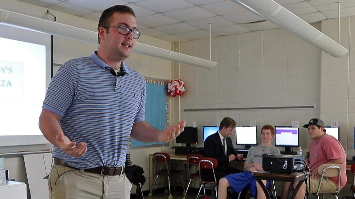 Sanderson High School senior Cody Ellison makes a pitch for a hypothetical pizza restaurant during a business class at the school in Raleigh n May 30, 2018.  Wake County school leaders say they may have to take steps such as raising class sizes and reducing the number of classes offered to students in order to close a $23.9 million budget gap.