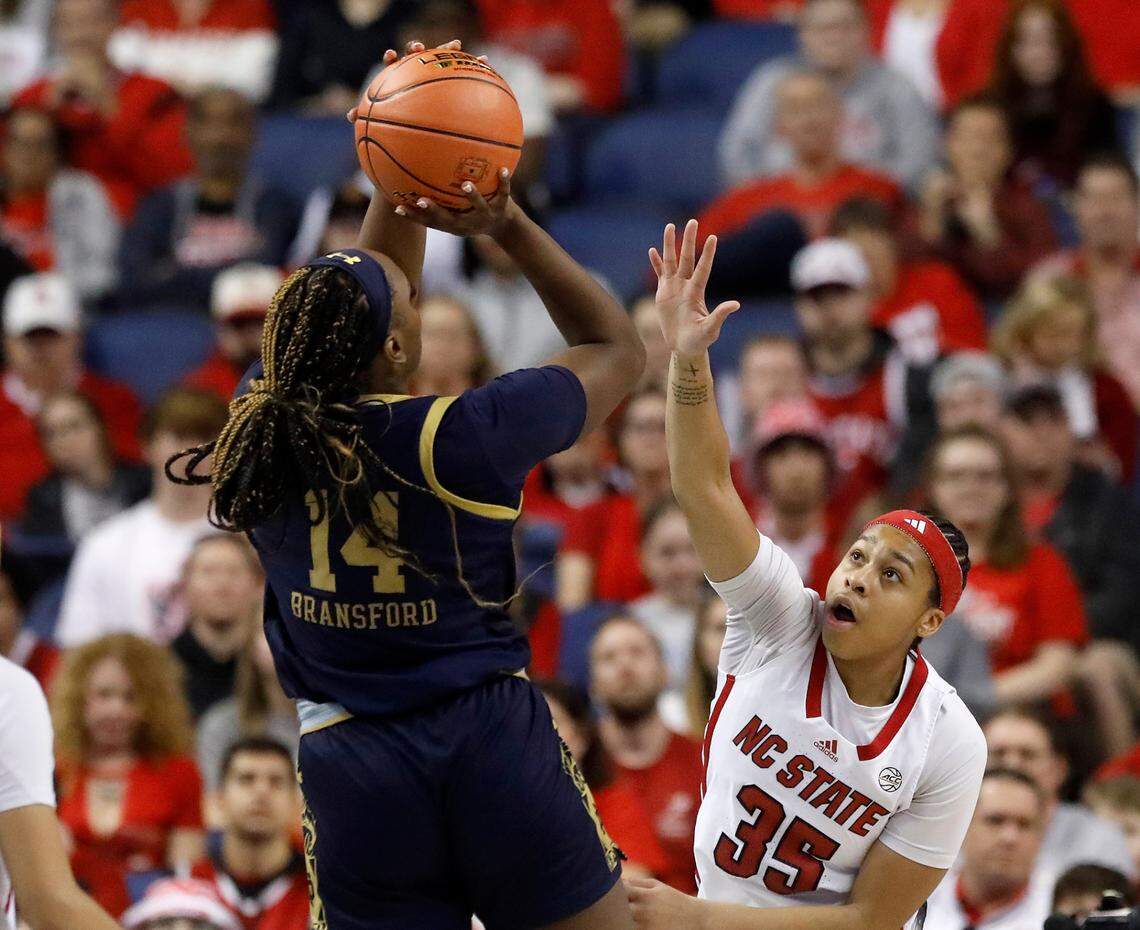 Notre Dame’s KK Bransford shoots over N.C. State’s Zoe Brooks during the first half of the Wolfpack’s 55-51 loss in the ACC Tournament final on Sunday, March 10, 2024, at Greensboro Coliseum in Greensboro, N.C.