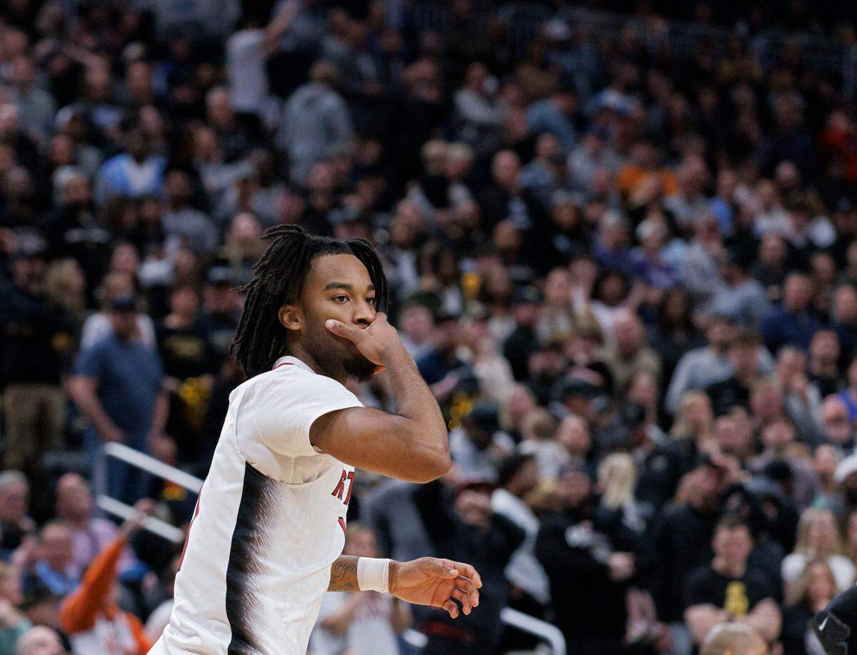 N.C. State’s Jayden Taylor reacts after knocking down a three-point basket during overtime of the Wolfpack’s 79-73 win against Oakland in the second round of the NCAA Tournament on Saturday, March 23, 2024, at PPG Paints Arena in Pittsburgh, Pa.