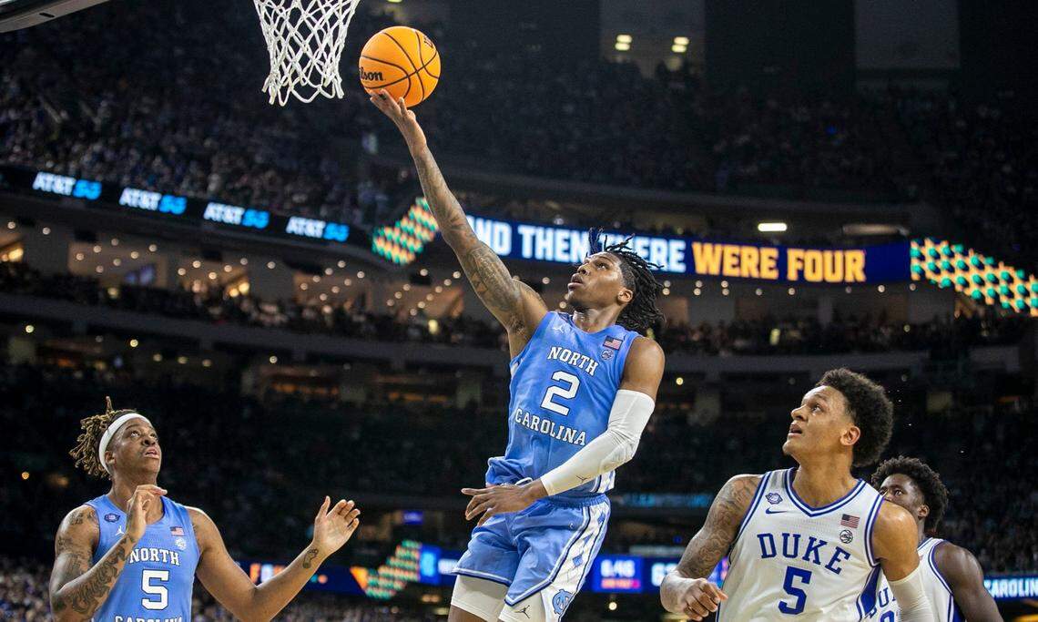 North Carolinas Caleb Love (2) drives to the basket past Dukes Paolo Banchero (5) for two of his game high 28 points, leading the Tar Heels to an 81-77 victory over Duke during the NCAA Final Four semi-final on Saturday, April 2, 2022 at Caesars Superdome in New Orleans, La