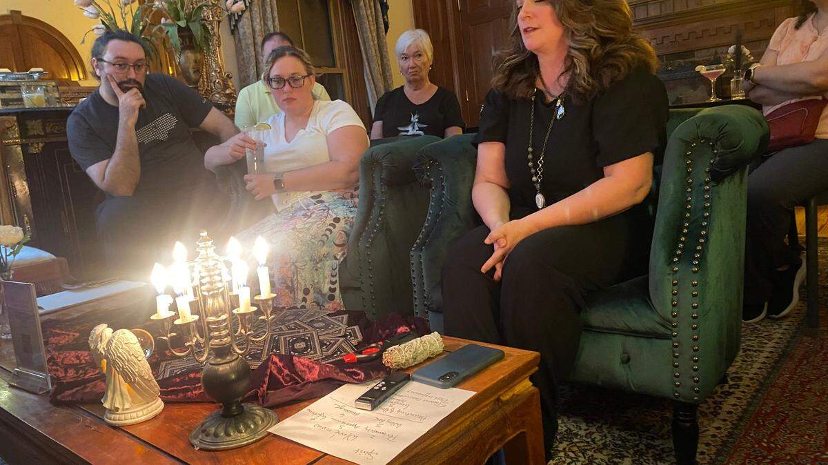 Katherine Loflin holds a tarot card reading inside the Matthews House to contact the dozens of spirits believed to be inhabiting the 1915 Cary home. Loflin’s paranormal investigation is part of her series of offbeat tours.