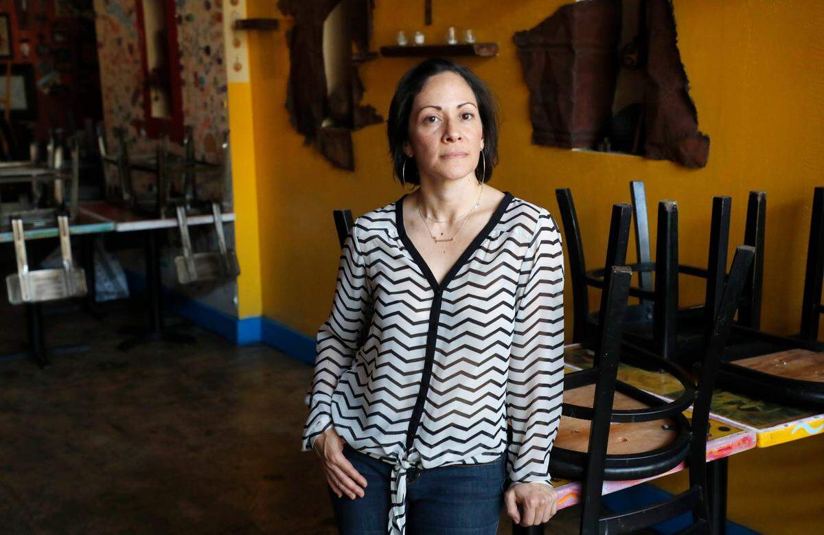 Angela Salamanca, owner of Centro, poses in her restaurant in downtown Raleigh, N.C., Wednesday, May 19, 2021.