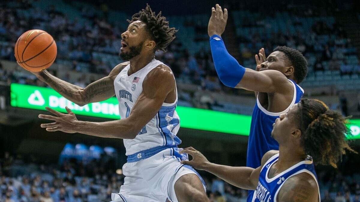 North Carolina’s Leaky Black (1) drives to the basket against UNC-Asheville’s B.J. Marable (11) during the first half on Tuesday, November 23, 2021 at the Smith Center in Chapel Hill, N.C.