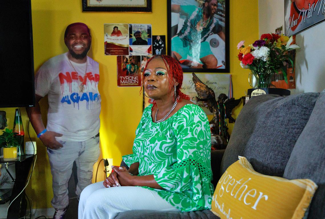 Henrietta Mason, photographed at her home on May 16, sits among photos of her son, Tyrone Mason, who died after his 2018 Chevrolet Malibu slammed into a concrete barrier on Capital Boulevard in Raleigh in October 2024.