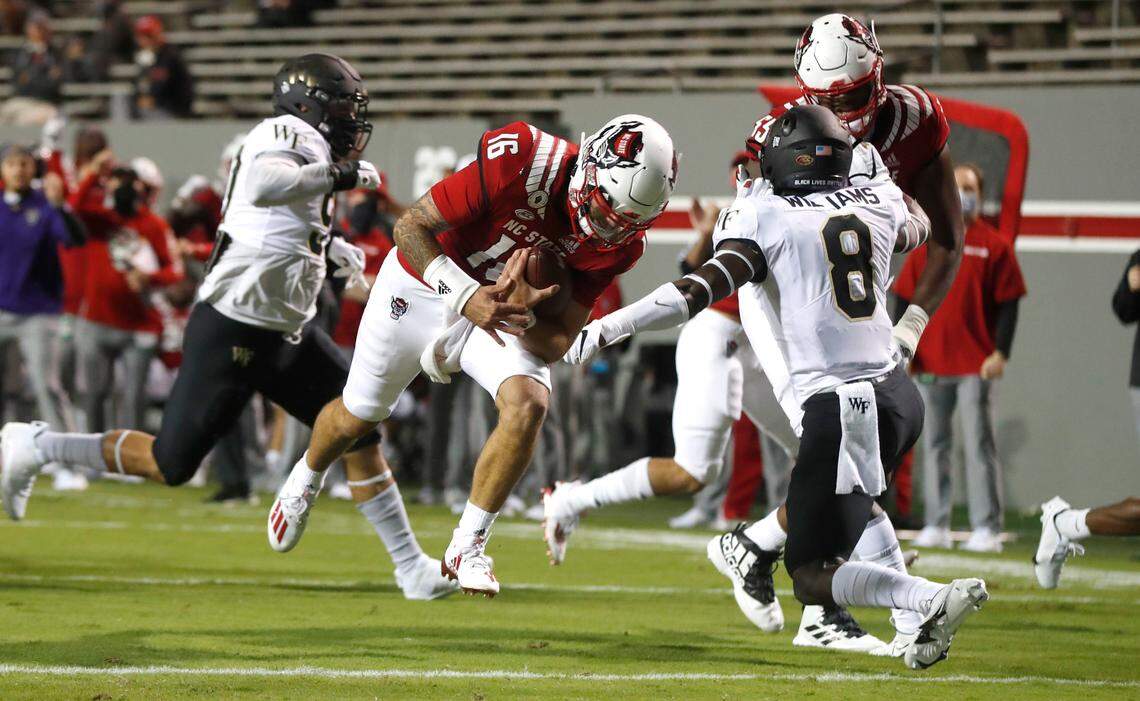 N.C. State quarterback Bailey Hockman (16) runs in for a 7-yard touchdown reception during the first half of N.C. State’s game against Wake Forest at Carter-Finley Stadium in Raleigh, N.C, Saturday, Sept. 19, 2020.