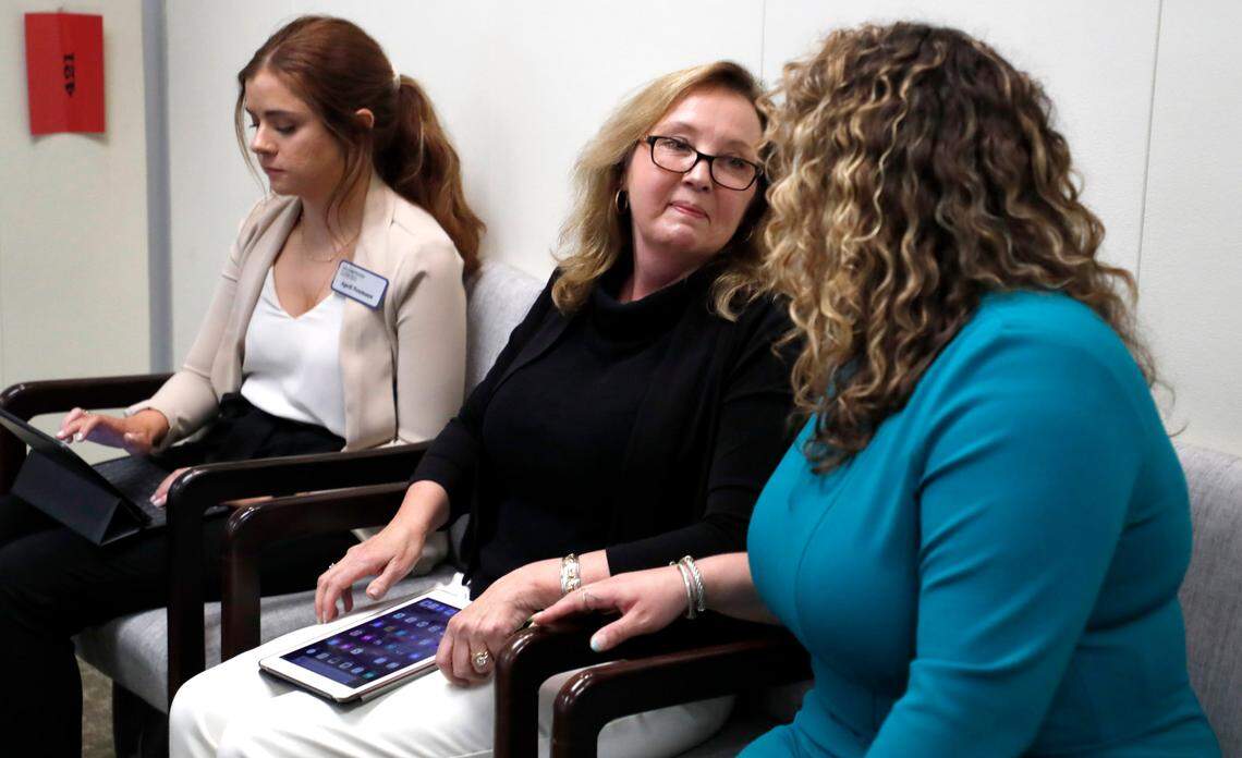 Judy Wiegand, center, talks with Laura Puryear, right, with McGuire Woods Consulting after Wiegand spoke during a House Judiciary Committee meeting Tuesday, June 22, 2021. Wiegand, who was married when she was 13, was speaking in favor of Senate Bill 35, which would raise the minimum age to be married to 16.
