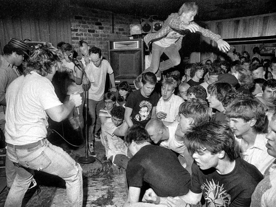 A punk rock fan goes airborne as a crowd dances to Suicidal Tendencies at the Brewery, in Raleigh, NC, April 22, 1985.