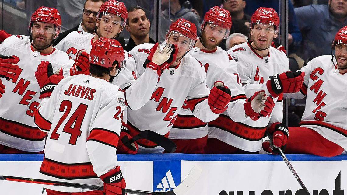 Carolina Hurricanes center Seth Jarvis (24) celebrates his goal against the New York Islanders with the Carolina Hurricanes bench during the first period in game four of the first round of the 2023 Stanley Cup Playoffs at UBS Arena.