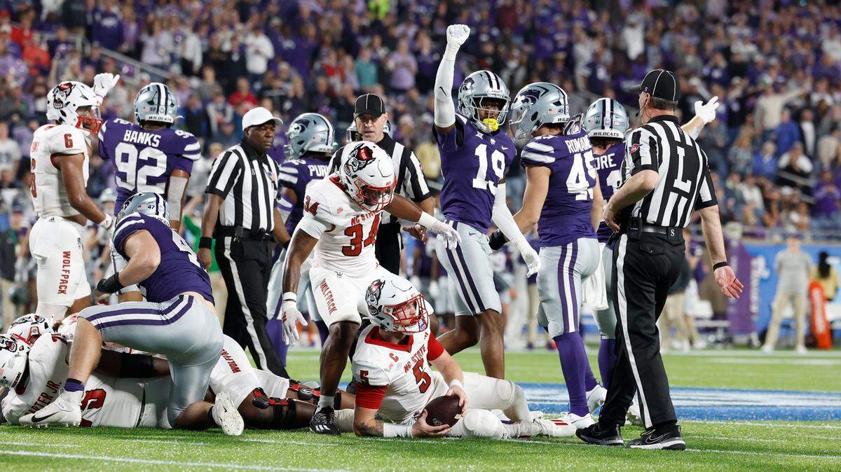 N.C. State quarterback Brennan Armstrong (5) looks up after failing to make the first down on fourth and one during the first half of N.C. State’s game against Kansas State in the Pop-Tarts Bowl at Camping World Stadium in Orlando, Fla., Thursday, Dec. 28, 2023.