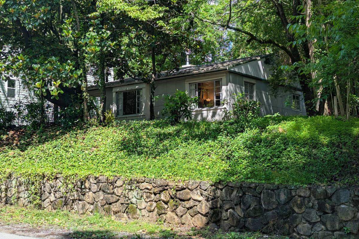 Set on a terraced, wooded .2-acre lot with a stone retaining wall, this home at 109 Stephens St. in Chapel Hill is one of 2,500 Lustron homes built, part of a short-lived housing revolution.