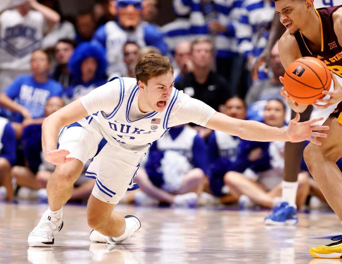 Duke’s Cooper Flagg (2) goes after the loose ball that Arizona State’s Alonzo Gaffney (8) tries to control during the second half of Duke’s 103-47 victory over Arizona State in the Brotherhood Run Charity Game at Cameron Indoor Stadium in Durham, N.C., Sunday, Oct. 27, 2024.