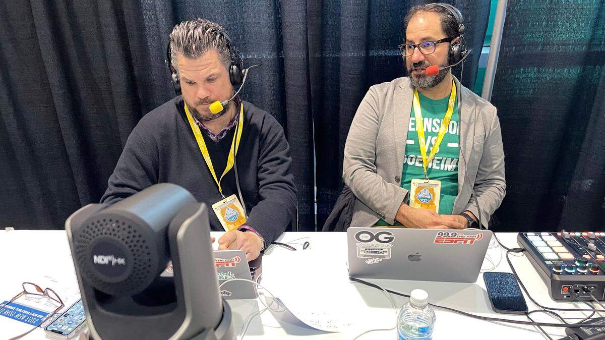 Joe Giglio, left, and Joe Ovies broadcast from the ACC Men’s Basketball Tournament in Greensboro, N.C., on Thursday, March 8, 2023.
