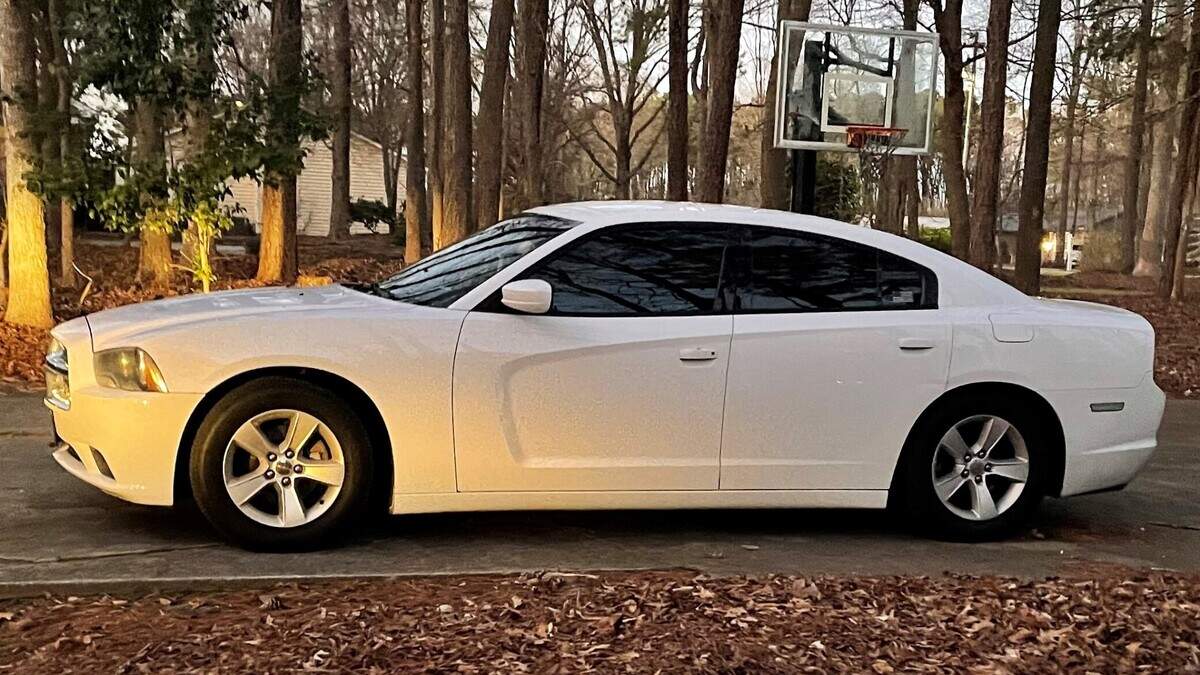 A man driving this Dodge Charger was arrested for impersonating a law enforcement officer after an off-duty Wake County deputy saw him driving with active blue lights.
