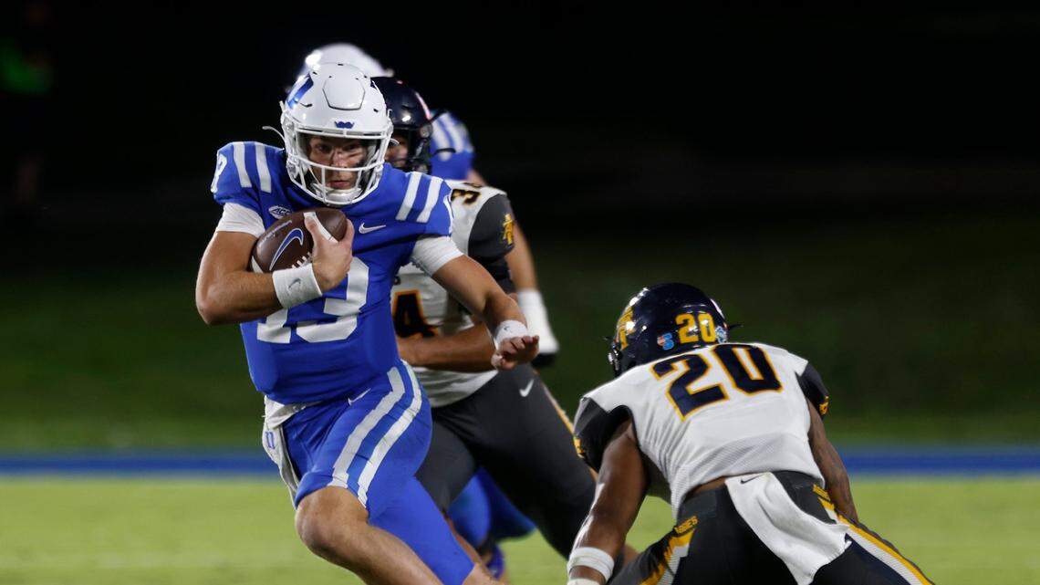 Duke Blue Devils quarterback Riley Leonard runs the ball past North Carolina A&T Aggies defensive back Avarion Cole during the second half of Dukes game against North Carolina A&T at Wallace Wade Stadium in Durham, N.C. on Saturday, Sept. 17, 2022.