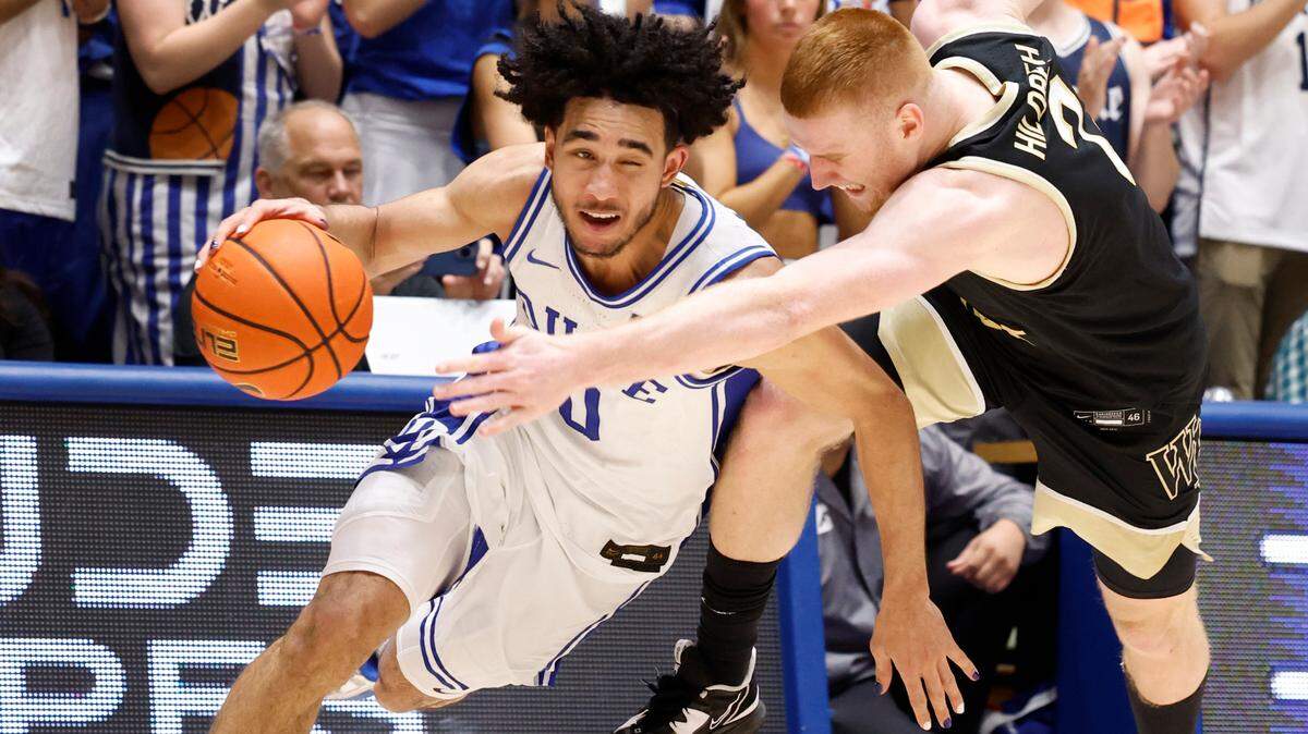 Duke’s Jared McCain (0) is fouled by Wake Forest’s Cameron Hildreth (2) during the second half of Duke’s 77-69 victory over Wake Forest at Cameron Indoor Stadium in Durham, N.C., Monday, Feb. 12, 2024.