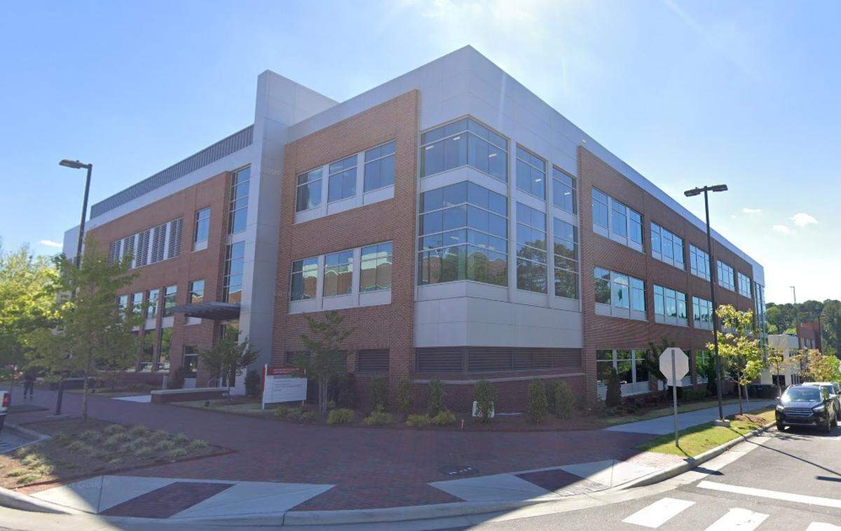 The Center for Technology & Innovation building, with a connected parking deck behind it.