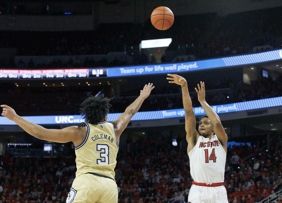 N.C. State’s Casey Morsell shoots over Georgia Tech’s Dallan Coleman during the first half of the Wolfpack’s 82-76 win on Saturday, Feb. 3, 2024, at PNC Arena in Raleigh, N.C.