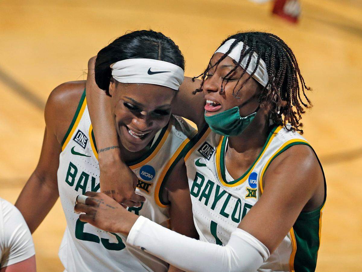 Baylor forward NaLyssa Smith (1) celebrates with teammate Baylor center Queen Egbo (25) at the end of the first half of a college basketball game in the second round of the women’s NCAA tournament at the Greehey Arena in San Antonio, Tuesday, March 23, 2021. 