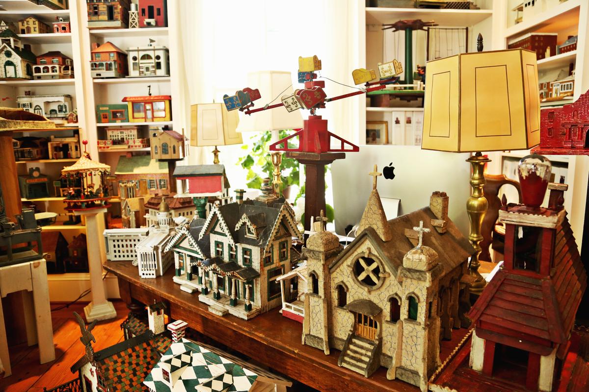 Steven Burke and his husband, Randy Campbell, have found fame with 1,200 miniature American Folk Art Buildings many of which are displayed throughout their Hillsborough home. The range of the collection are varied from houses and churches, stores and factories, to carousels and ferris wheels and castles and capitols.