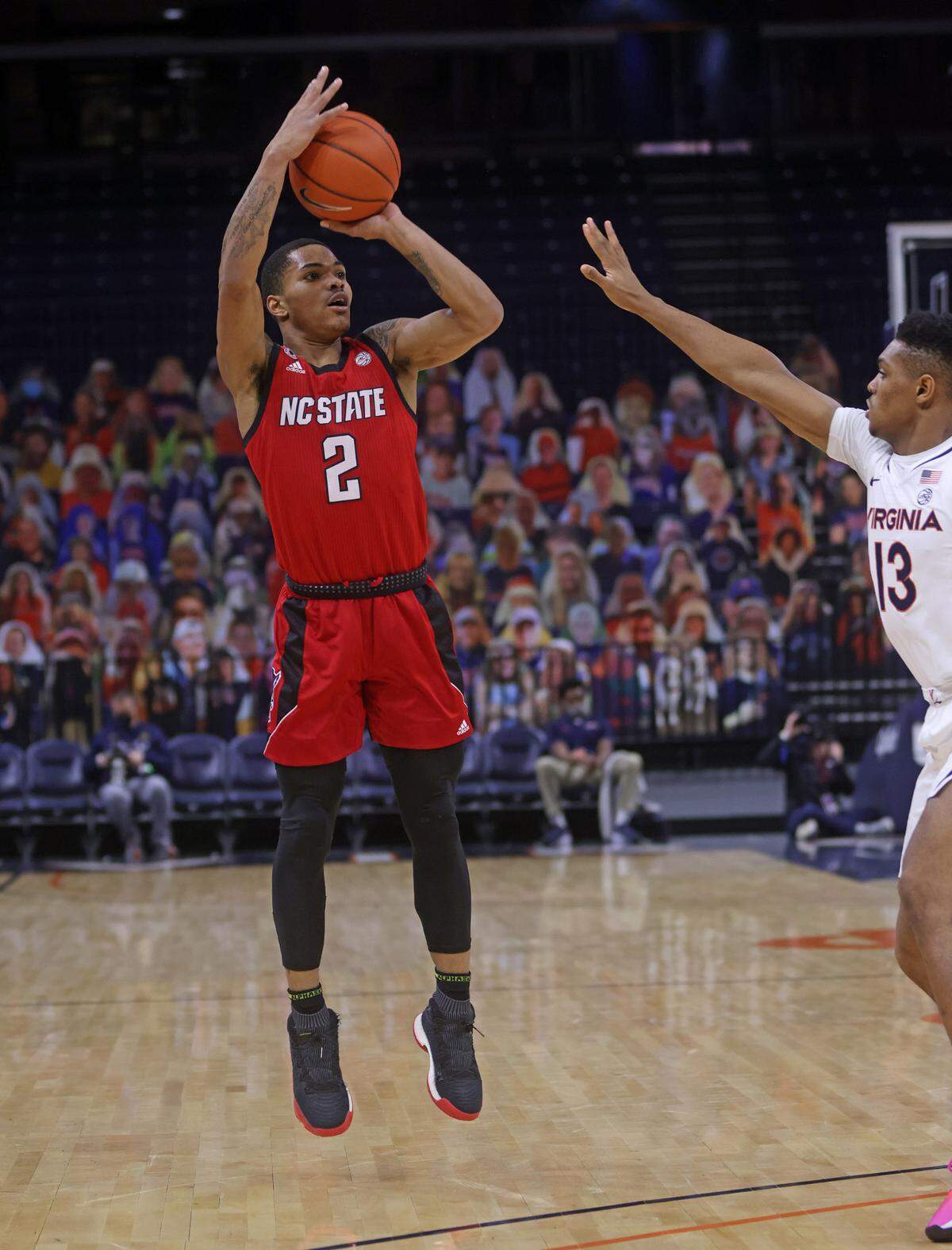North Carolina State guard Shakeel Moore (2) shoots a basket over Virginia guard Casey Morsell (13) during the game Wednesday in Charlottesville.