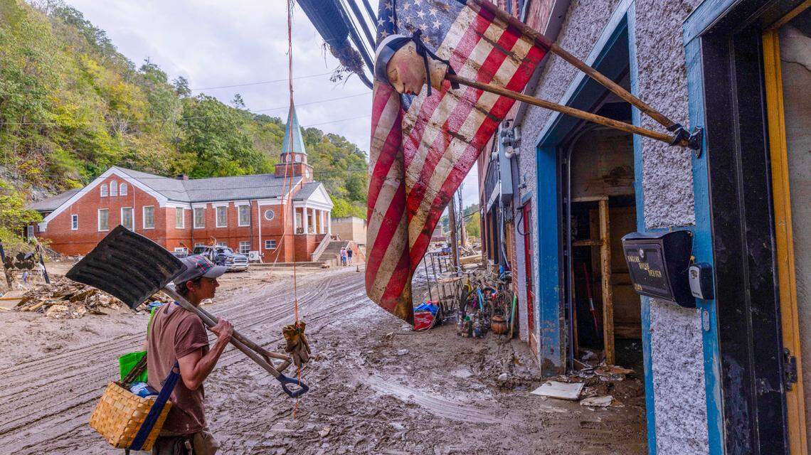 Jen Dombrowski arrives in downtown Marshall to help a friend clean up her business on Tuesday, Oct. 1, 2024 after the French Broad River caused catastrophic flooding. The remnants of Hurricane Helene caused widespread flooding, downed trees, and power outages in western North Carolina.