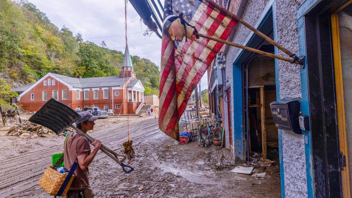 Jen Dombrowski arrives in downtown Marshall to help a friend clean up her business on Tuesday, Oct. 1, 2024 after the French Broad River caused catastrophic flooding. The remnants of Hurricane Helene caused widespread flooding, downed trees, and power outages in western North Carolina.